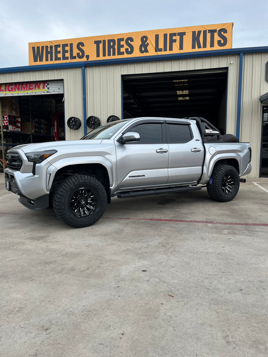 2024-2026 TOYOTA TACOMA WITH 17X9 FUEL BLITZ WHEELS, 33X12.50R17 RT TIRED AND 1.5" LEVELING KIT - GALLERY