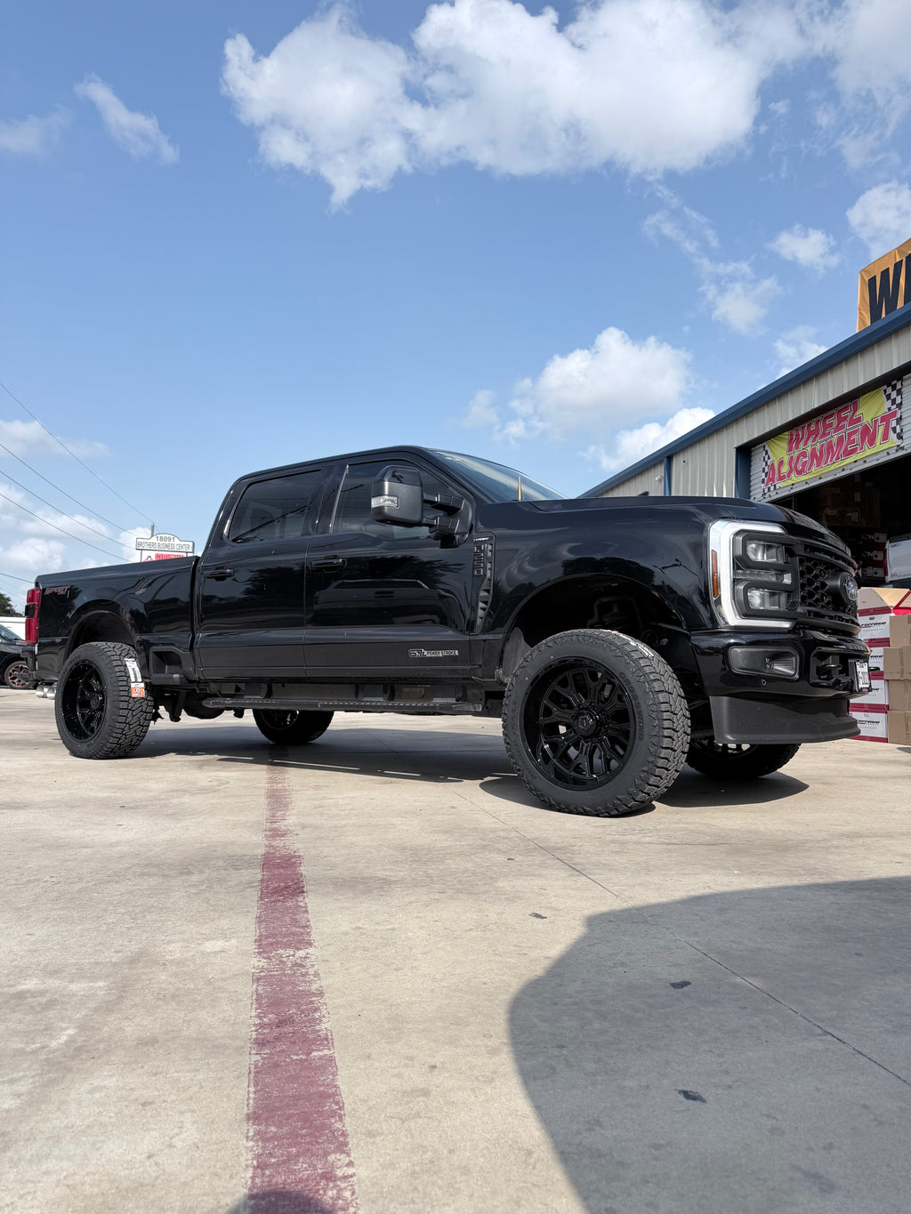 2021 - 2027 FORD F-250 WITH 22X12 TIS 560B WHEELS AND 35X12.50R22 RT TIRES - GALLERY